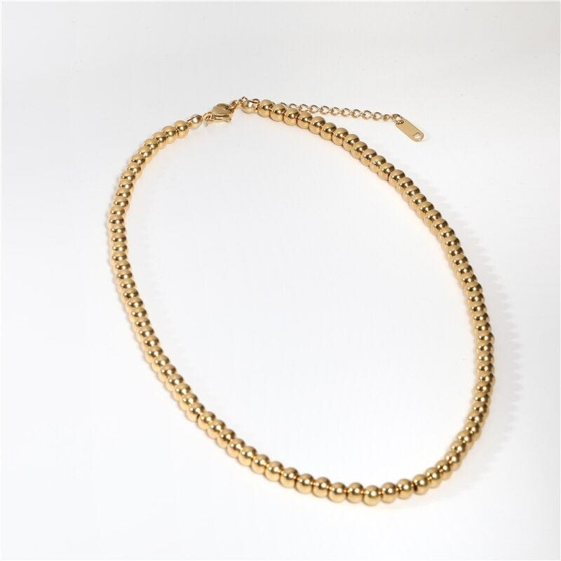 Leonidas Ball Beaded Necklace featuring gold beaded design and stainless steel material, showcasing elegance and durability.