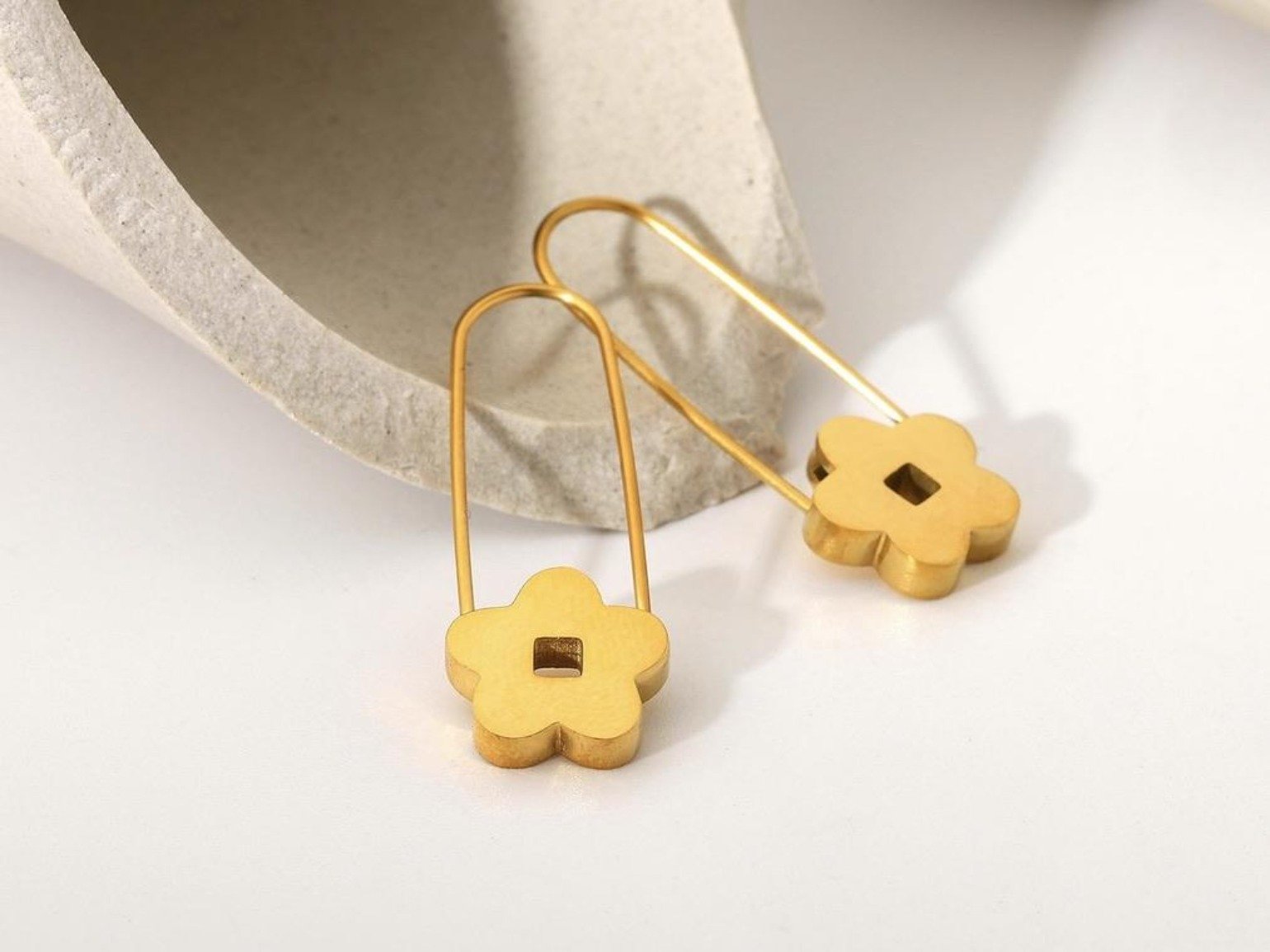 Leslie Earrings featuring a petite floral pink design, crafted from gold plated stainless steel, lightweight and hypoallergenic.