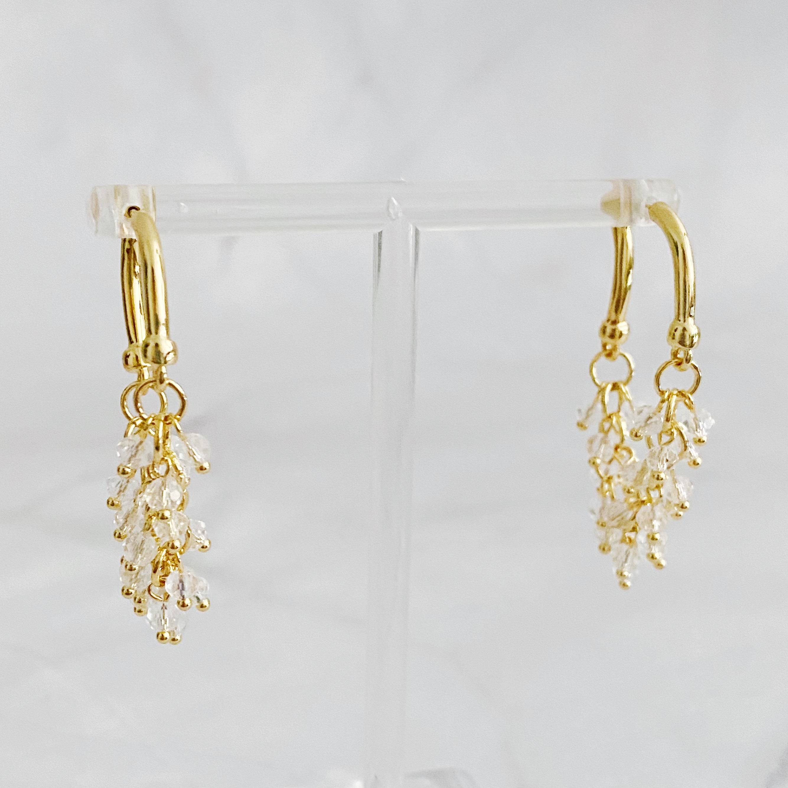 Elegant Let's Wrap It Up Earrings featuring draped beads in gold plating, perfect for any occasion.