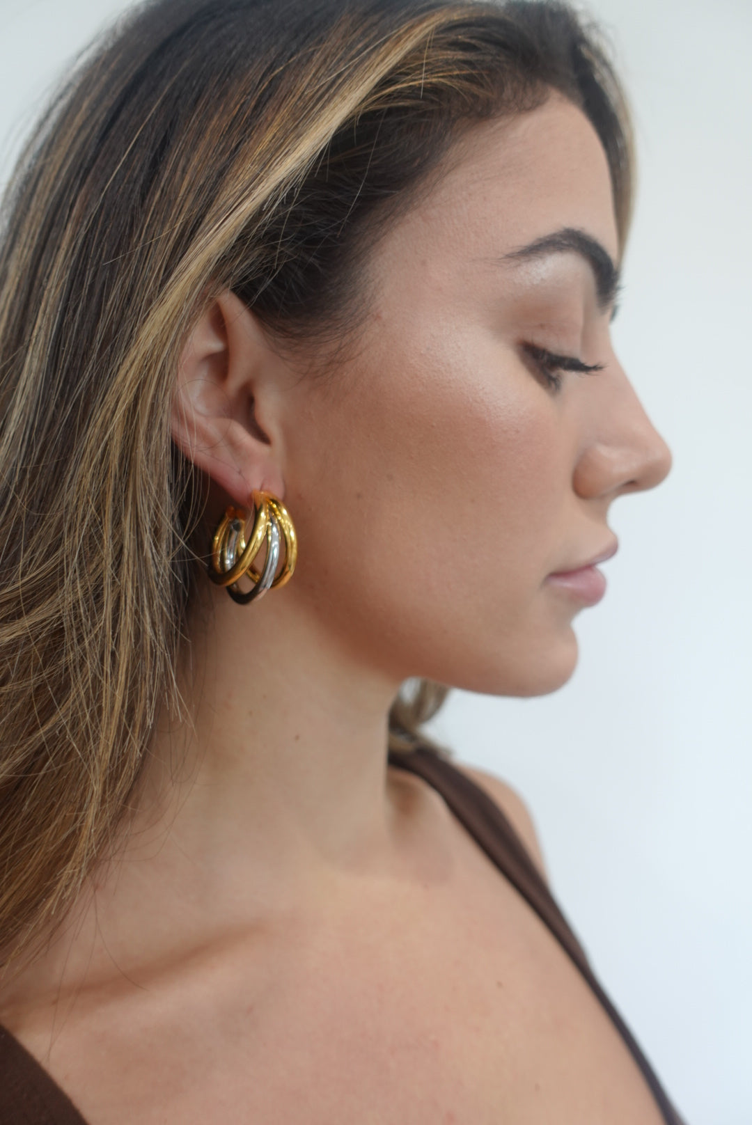 Lexi Tri Hoop earrings in two-tone design, featuring elegant shape and 18K gold plating over sterling silver.