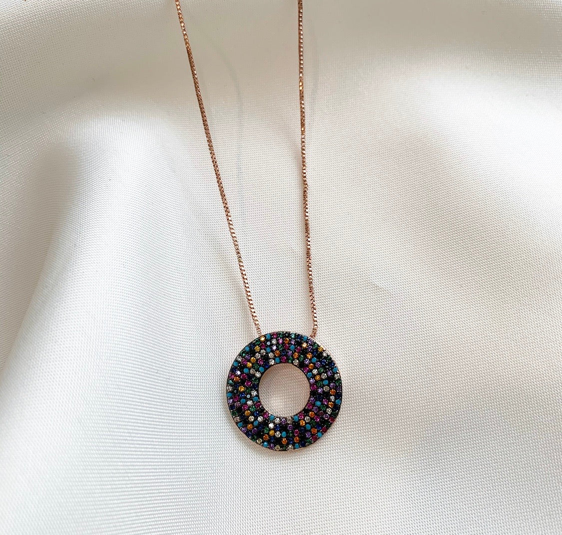 LIA Necklace featuring colorful cubic zirconia stones on a black-finished eternity circle pendant with a 14k rose gold plated cable chain.