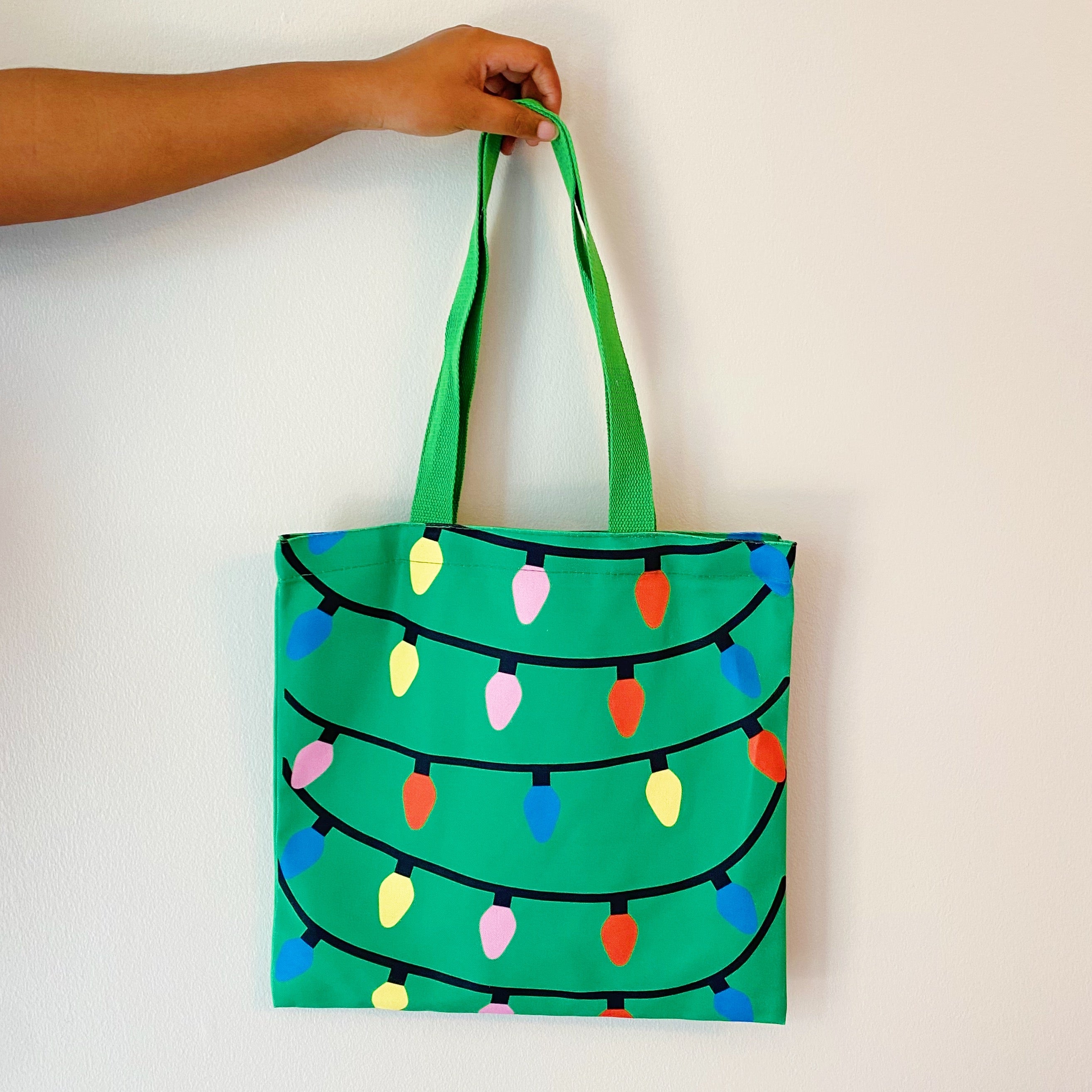 Light Up The Joy Canvas Tote featuring a bright, cheerful design, spacious interior, and durable shoulder straps, perfect for everyday use.