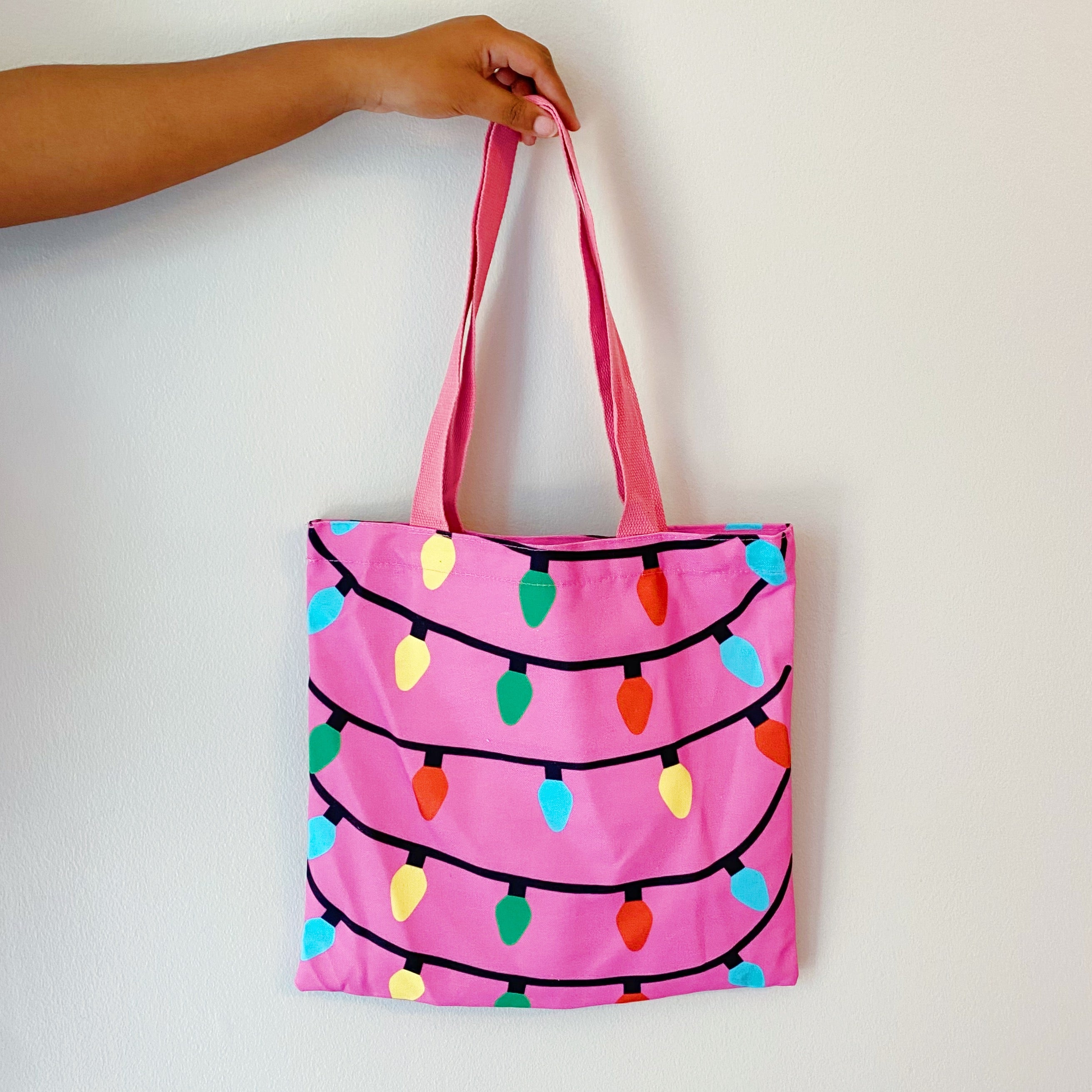 Light Up The Joy Canvas Tote featuring a bright, cheerful design, spacious interior, and durable shoulder straps, perfect for everyday use.