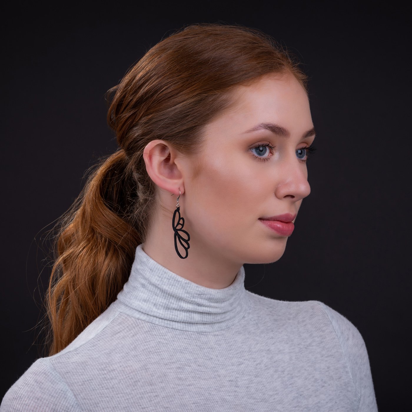 Lilac Upcycled Inner Tube Earrings, handcrafted from reclaimed rubber with silver hooks, showcasing a unique off-centre design.