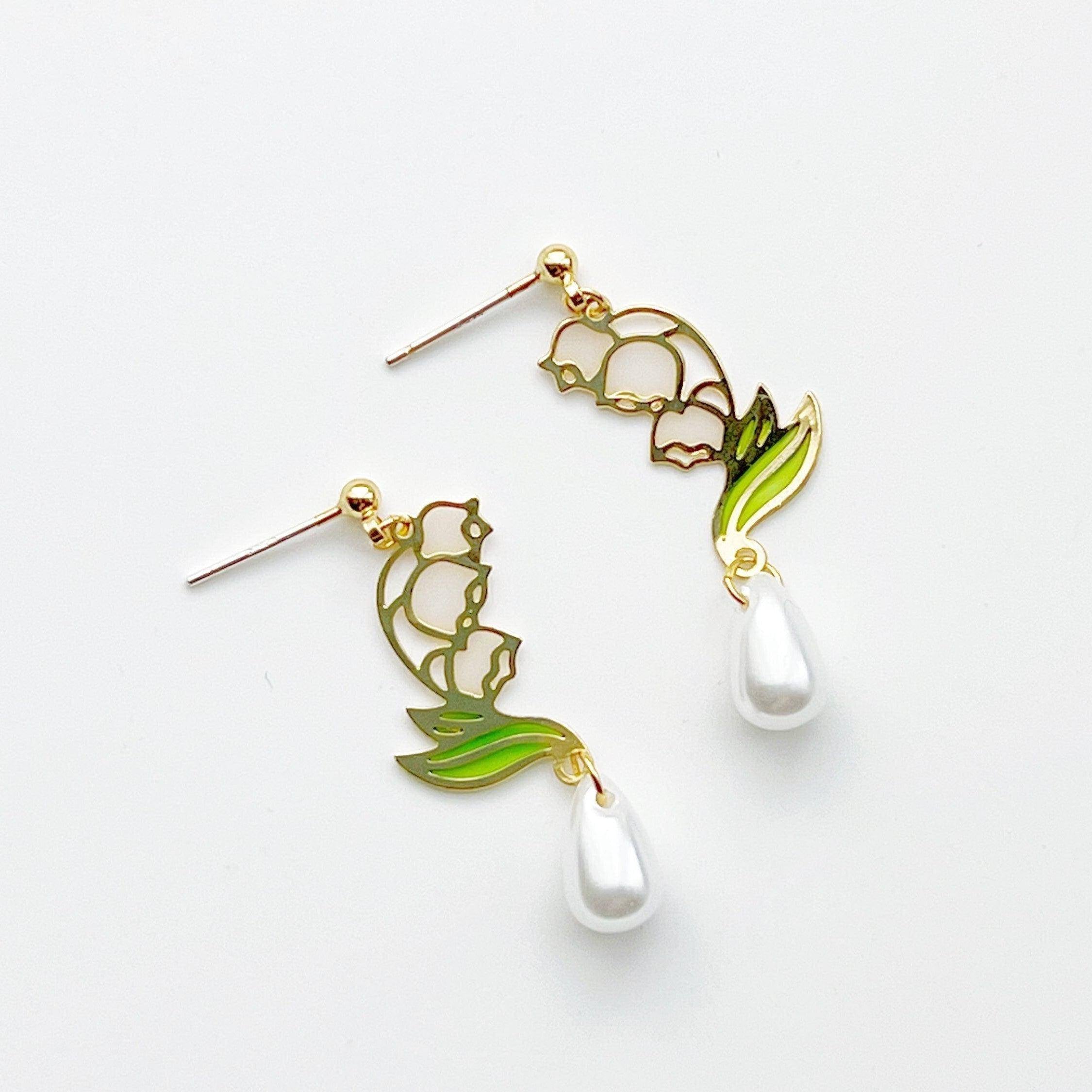 Elegant Lily of the Valley Earrings featuring white bell-shaped flowers, crafted from sterling silver and gold-plated bronze.