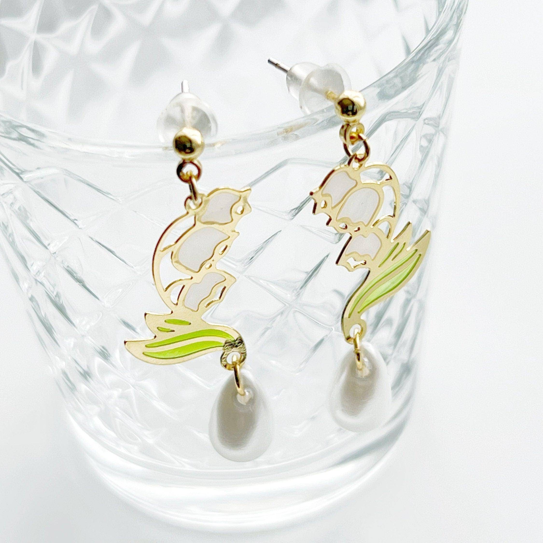 Elegant Lily of the Valley Earrings featuring white bell-shaped flowers, crafted from sterling silver and gold-plated bronze.