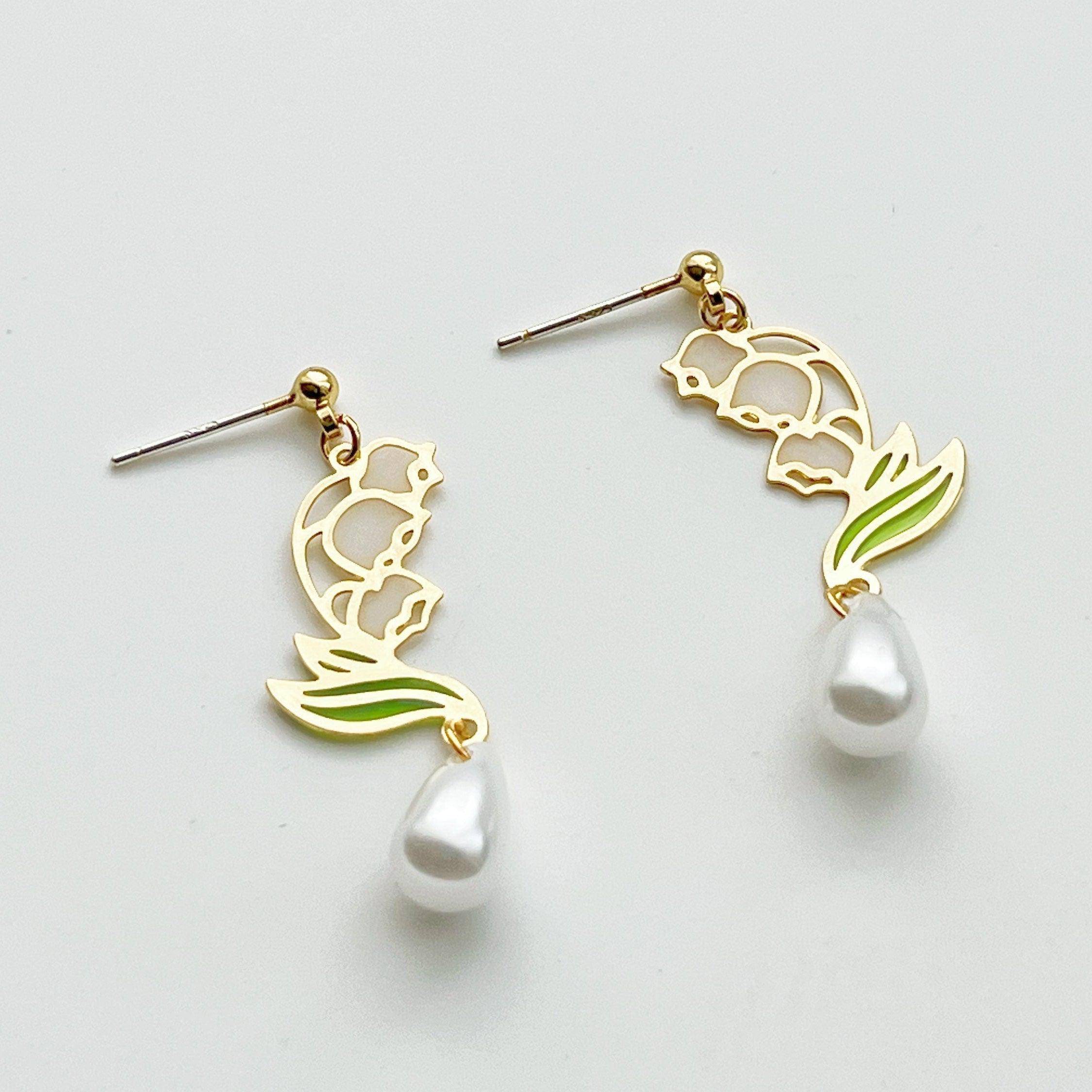 Elegant Lily of the Valley Earrings featuring white bell-shaped flowers, crafted from sterling silver and gold-plated bronze.