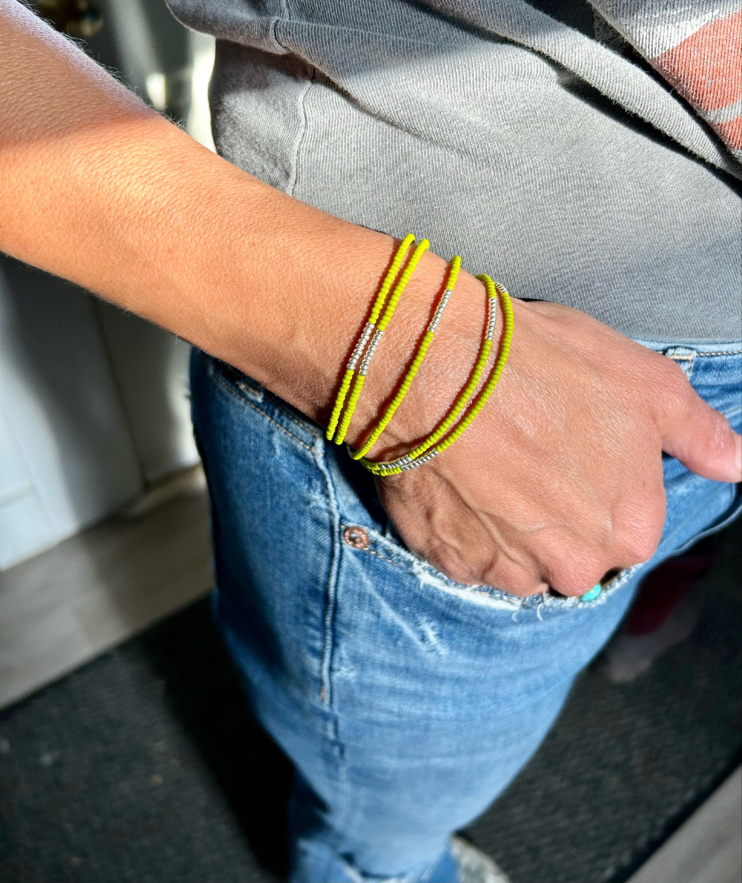 Lime green beaded 5-wrap bracelet with silver stripes, showcasing vibrant Czech glass beads and strong elastic cording.