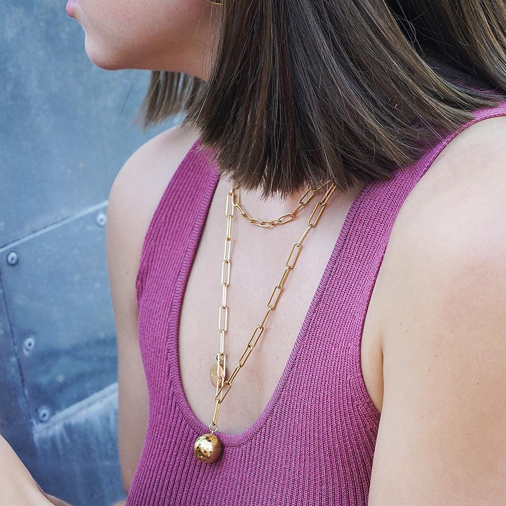 Linear Link Set featuring a ball pendant necklace and a classic CZ band ring in solid 14k yellow gold.