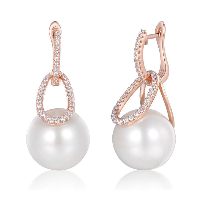 Elegant Link Pearl Dangle Earrings made of sterling silver with white sapphires and shell pearls.