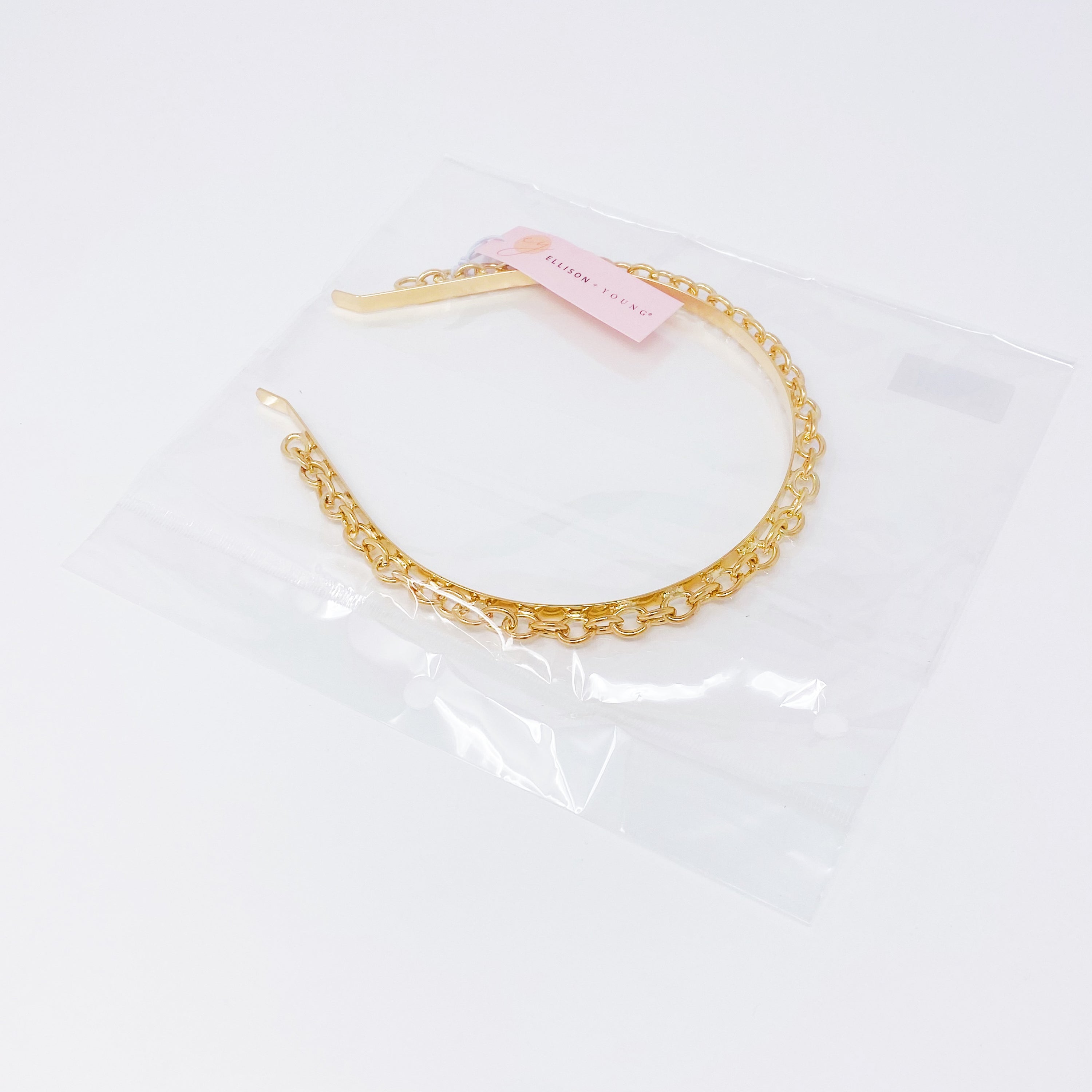 A stylish Linked Chain Headband featuring small O-shaped linked chains, perfect for adding elegance to any outfit.