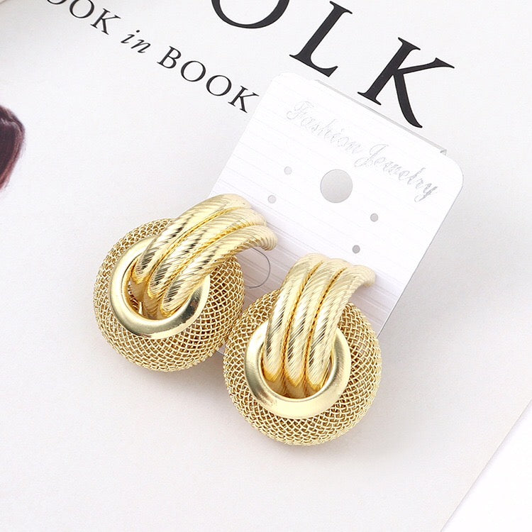 A pair of elegant linking honeycomb earrings made from alloy and steel, showcasing a unique honeycomb design.