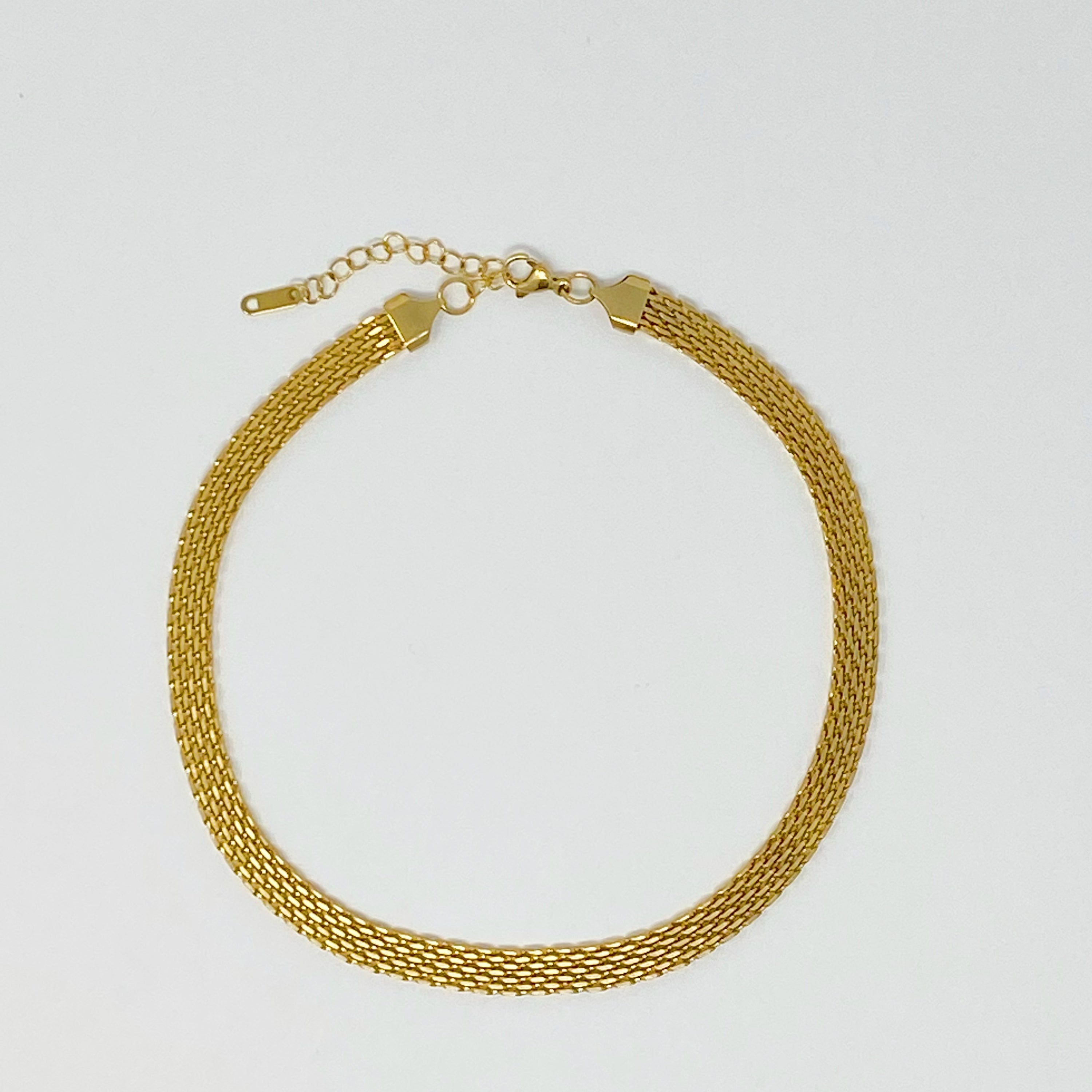 A stylish mesh gold linked necklace with adjustable length, showcasing its elegant design and high-quality finish.