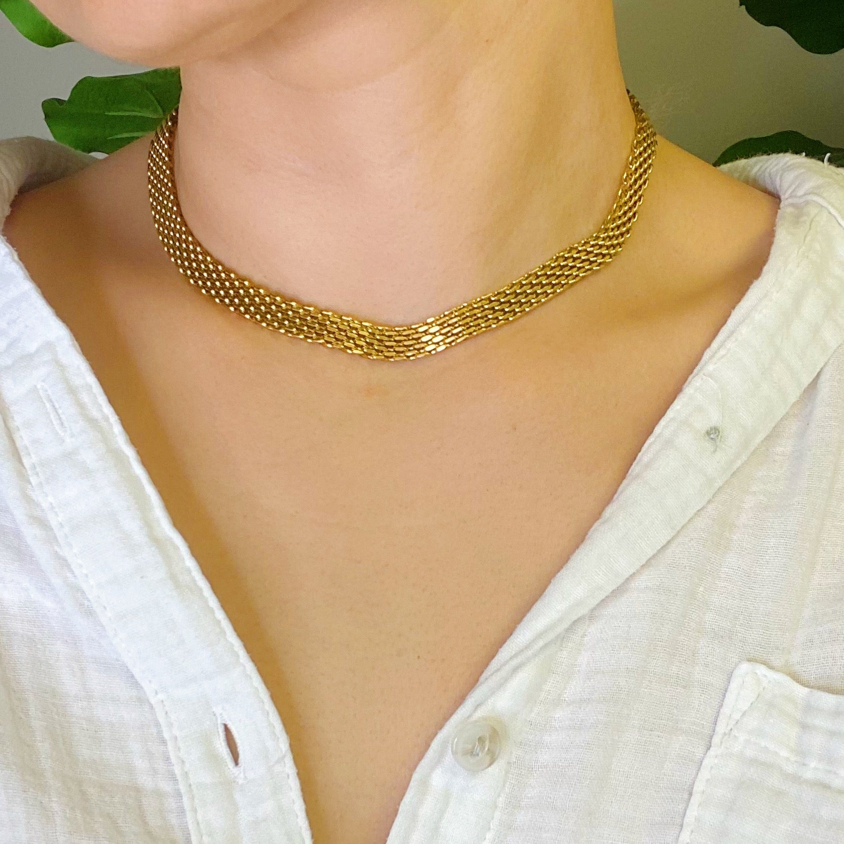 A stylish mesh gold linked necklace with adjustable length, showcasing its elegant design and high-quality finish.