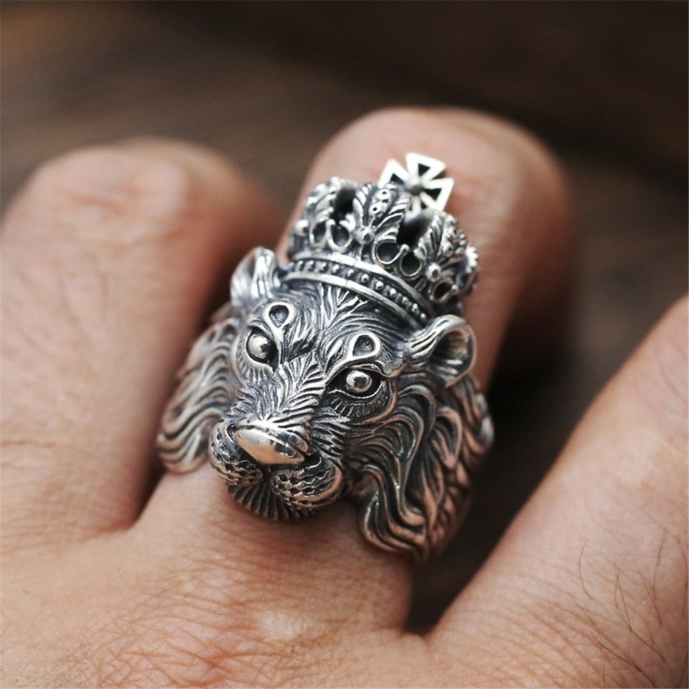 A stunning alloy ring featuring a detailed lion design atop a crown, symbolizing strength and royalty.