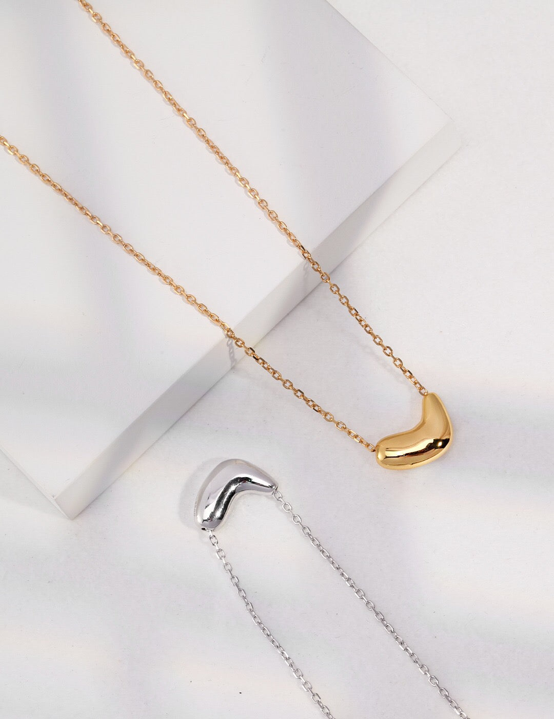 A delicate Little Bean Necklace made of gold vermeil, showcasing its elegant design and craftsmanship.