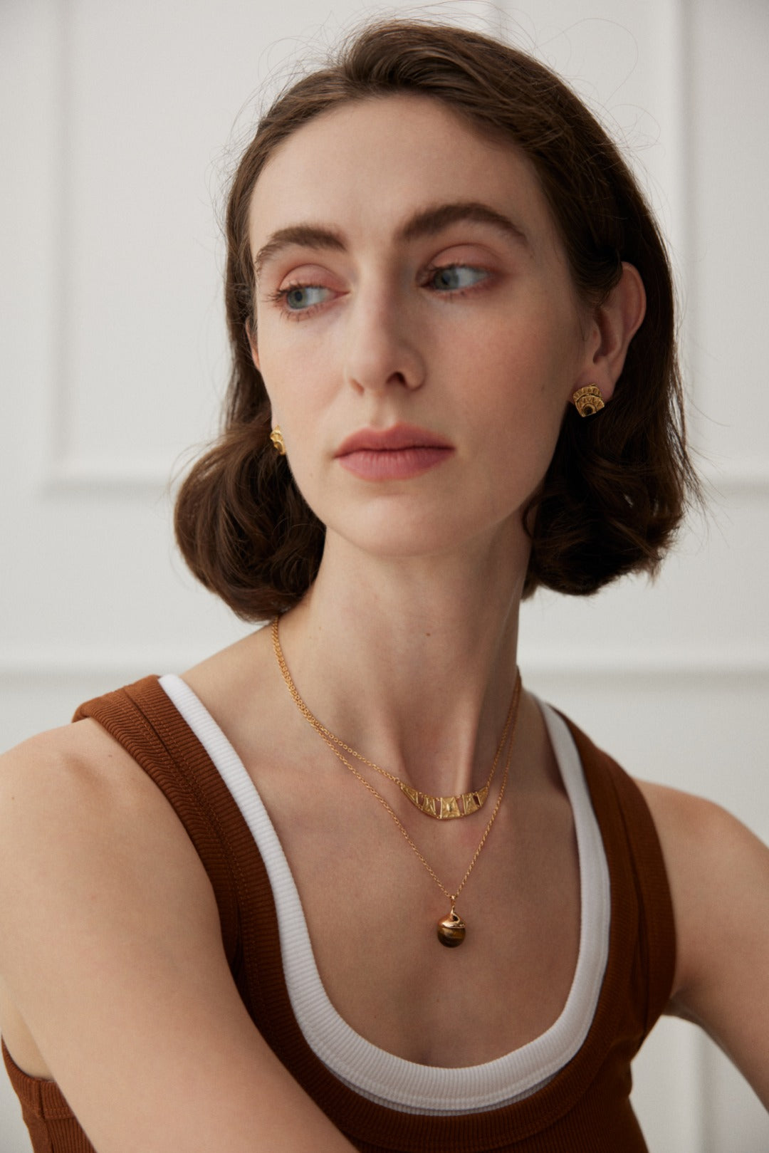 Little Hazelnut Pinecone Silver Necklace featuring tiger's eye stone and gray shell pearls, elegantly designed with a vintage gold chain.