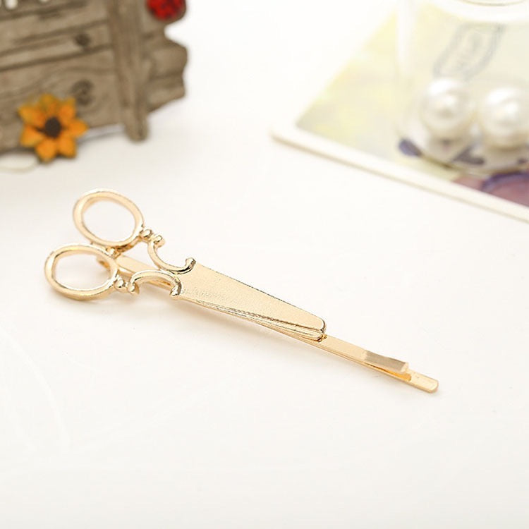 A stylish Little Scissor Hair Pin made of alloy, featuring a unique scissor design, perfect for securing hair in various styles.