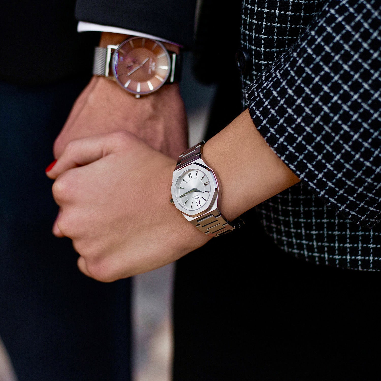 Livia Silver watch featuring bold Roman numerals, square stones, and a multi-link bracelet strap with a butterfly clasp.