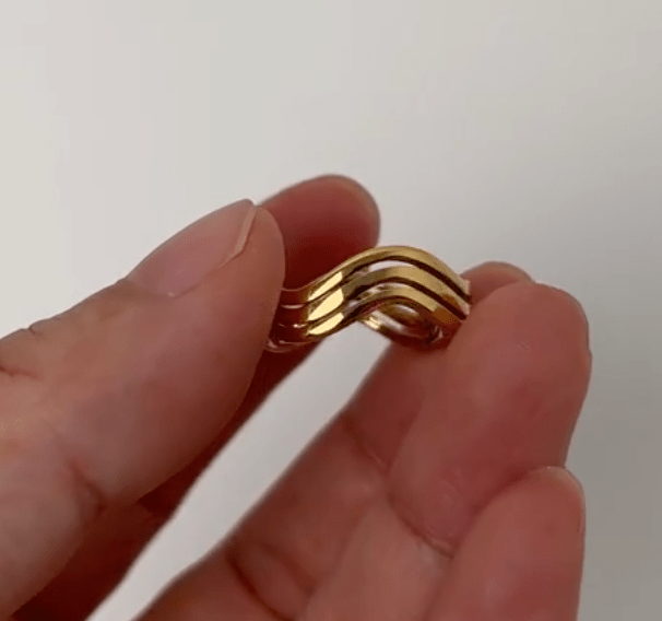 Livorno Triple Wave Layering Ring in 18k gold paved stainless steel, showcasing its elegant triple wave design.