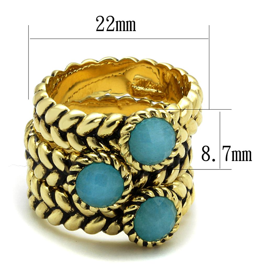 Gold brass ring featuring a sea blue synthetic cat eye stone, elegantly designed for stylish wear.