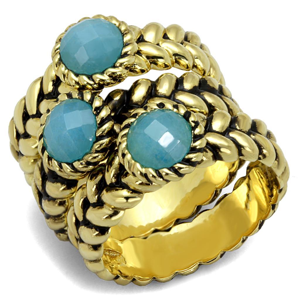 Gold brass ring featuring a sea blue synthetic cat eye stone, elegantly designed for stylish wear.