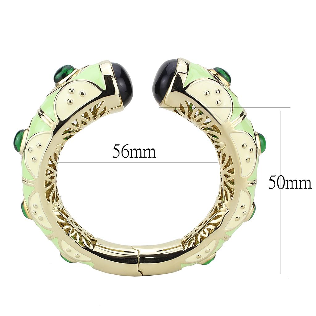 Gold brass bangle featuring a vibrant synthetic emerald centerpiece, elegantly designed for stylish wear.