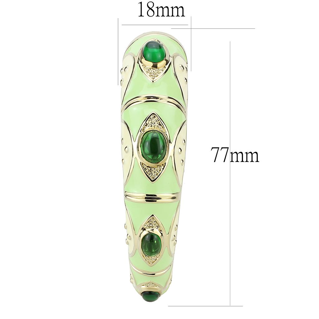 Gold brass bangle featuring a vibrant synthetic emerald centerpiece, elegantly designed for stylish wear.