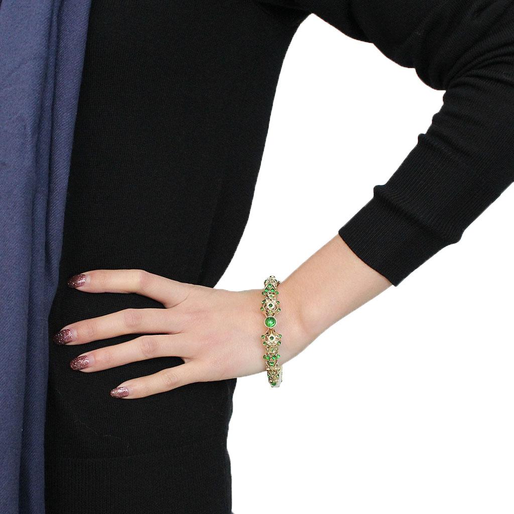 LO4300 Gold Brass Bangle featuring assorted emerald stones, elegantly designed for stylish wear.