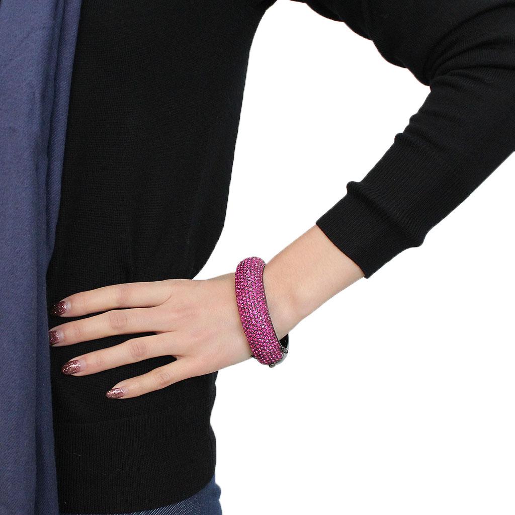 LO4303 TIN Cobalt Black Brass Bangle featuring a vibrant fuchsia top-grade crystal, elegantly designed for stylish wear.