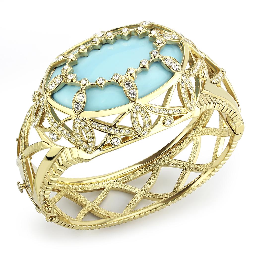 Elegant LO4348 Gold Brass Bangle featuring a vibrant sea blue synthetic stone, perfect for stylish accessorizing.