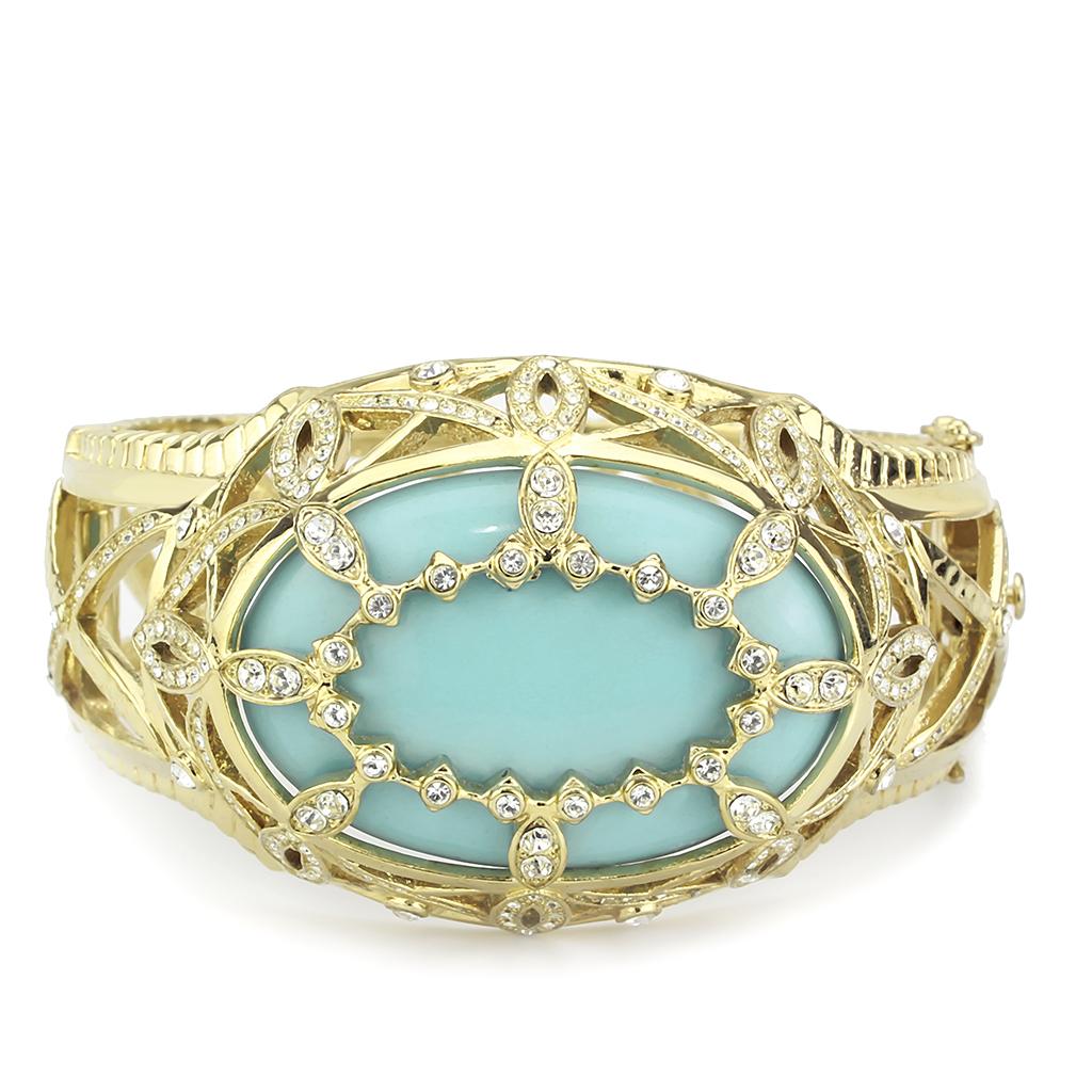 Elegant LO4348 Gold Brass Bangle featuring a vibrant sea blue synthetic stone, perfect for stylish accessorizing.