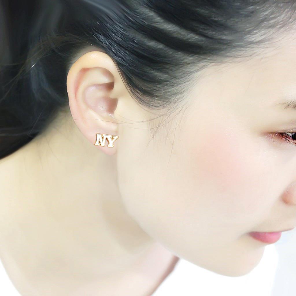 Elegant LO4666 gold brass earrings featuring a white epoxy stone, perfect for any occasion.