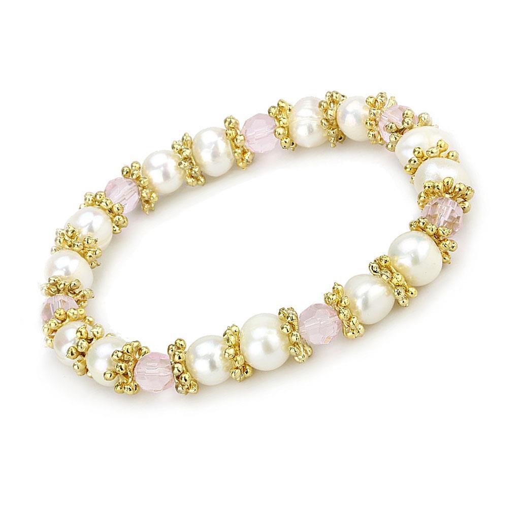 Antique silver bracelet made of white metal featuring a rose-colored synthetic pearl centerpiece, showcasing vintage elegance.