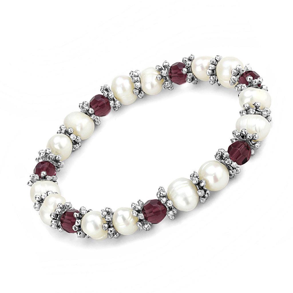 Antique silver white metal bracelet featuring a vibrant fuchsia synthetic pearl centerpiece, showcasing vintage elegance.