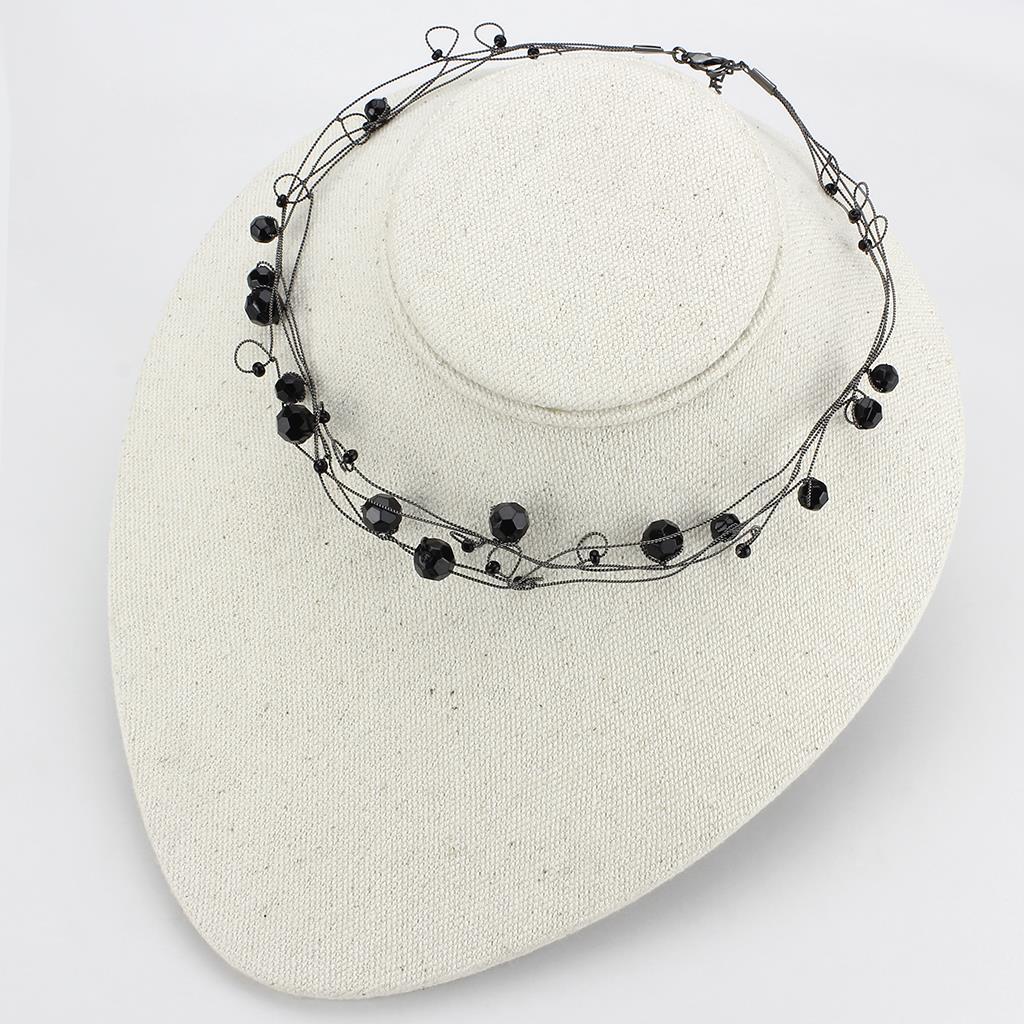 LO4714 Ruthenium White Metal Necklace featuring a jet black synthetic glass centerpiece, elegantly designed for versatile wear.