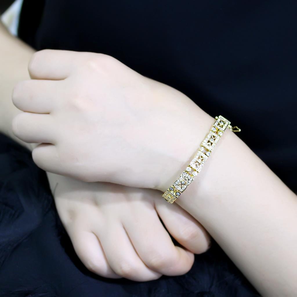 Gold brass bracelet featuring AAA grade clear cubic zirconia stone, elegantly designed for versatile wear.