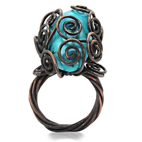 Antique tone brass ring featuring a vibrant synthetic turquoise stone, showcasing intricate details and a vintage design.