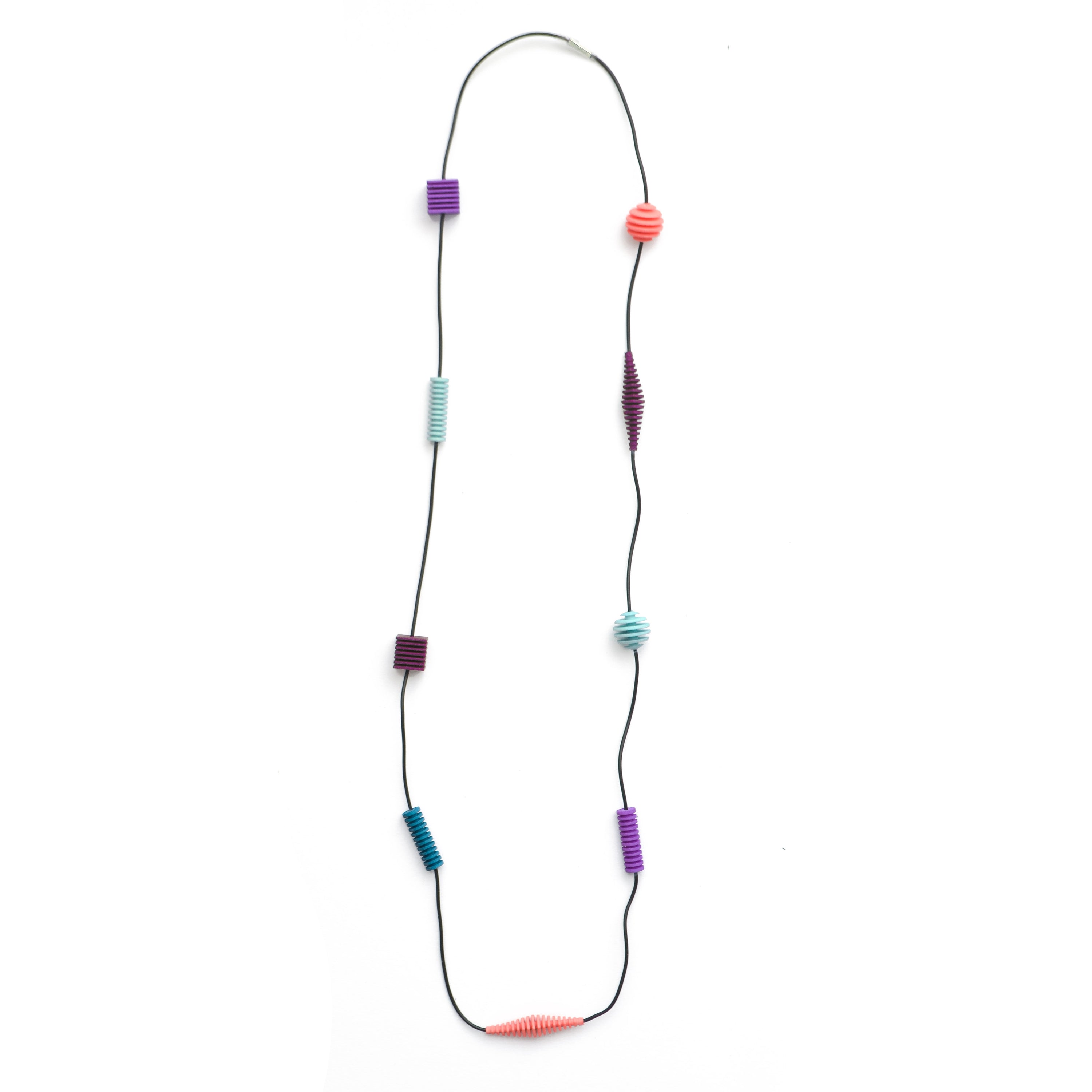 Long Beaded Optical Necklace featuring vibrant hand-dyed beads in geometric shapes, perfect for stylish outfits.