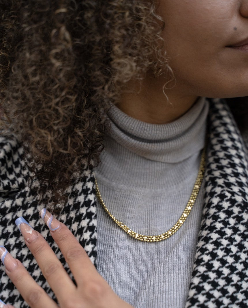 A stunning Long Chainmail Necklace in silver and gold plating, showcasing its elegant design and intricate chainmail construction.