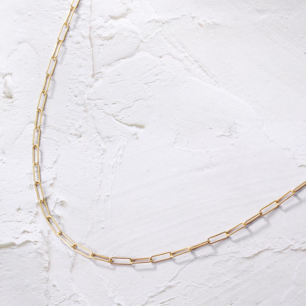 A stylish Long Linear Link Chain Necklace made of 316L surgical stainless steel with 14K gold PVD plating, showcasing its elegant design.