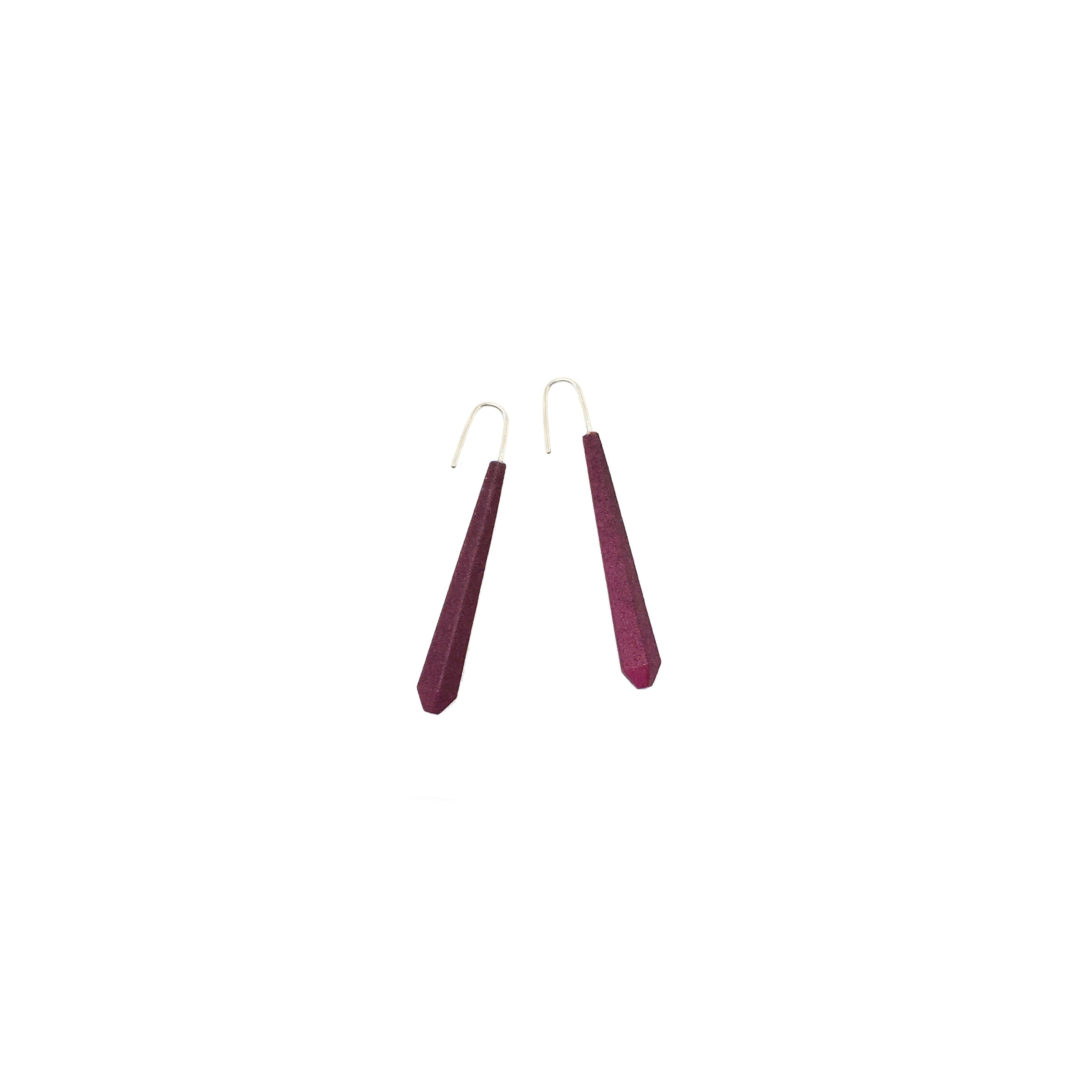 Long Pentagon Earrings in vibrant colors, featuring a geometric design with sterling silver hooks, displayed in a fabric pouch.