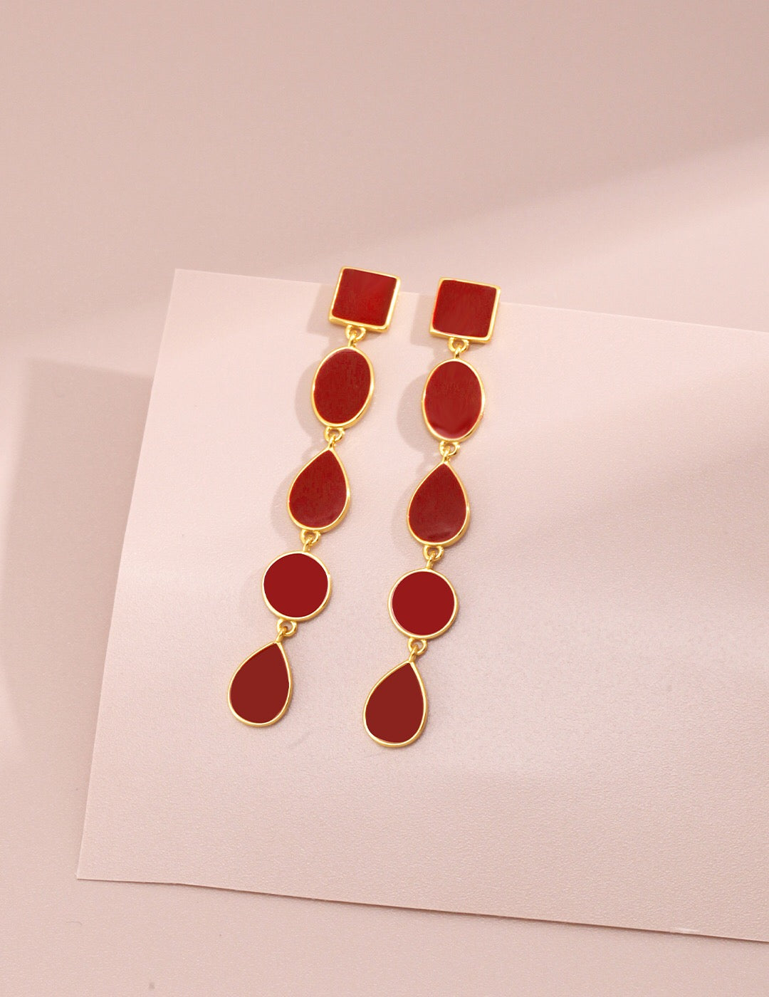 Long Red Drip Glaze Dangle Earrings featuring a vibrant red glaze and gold vermeil accents, elegantly handcrafted for a unique look.