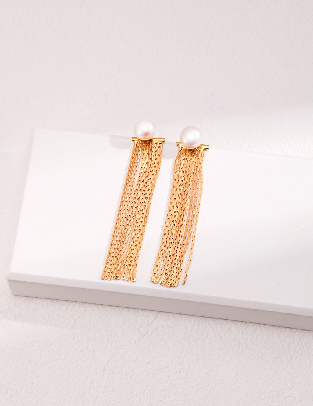 Elegant Long Tassel Pearl Earrings featuring genuine freshwater pearls and gold vermeil, showcasing a beautiful design perfect for any occasion.