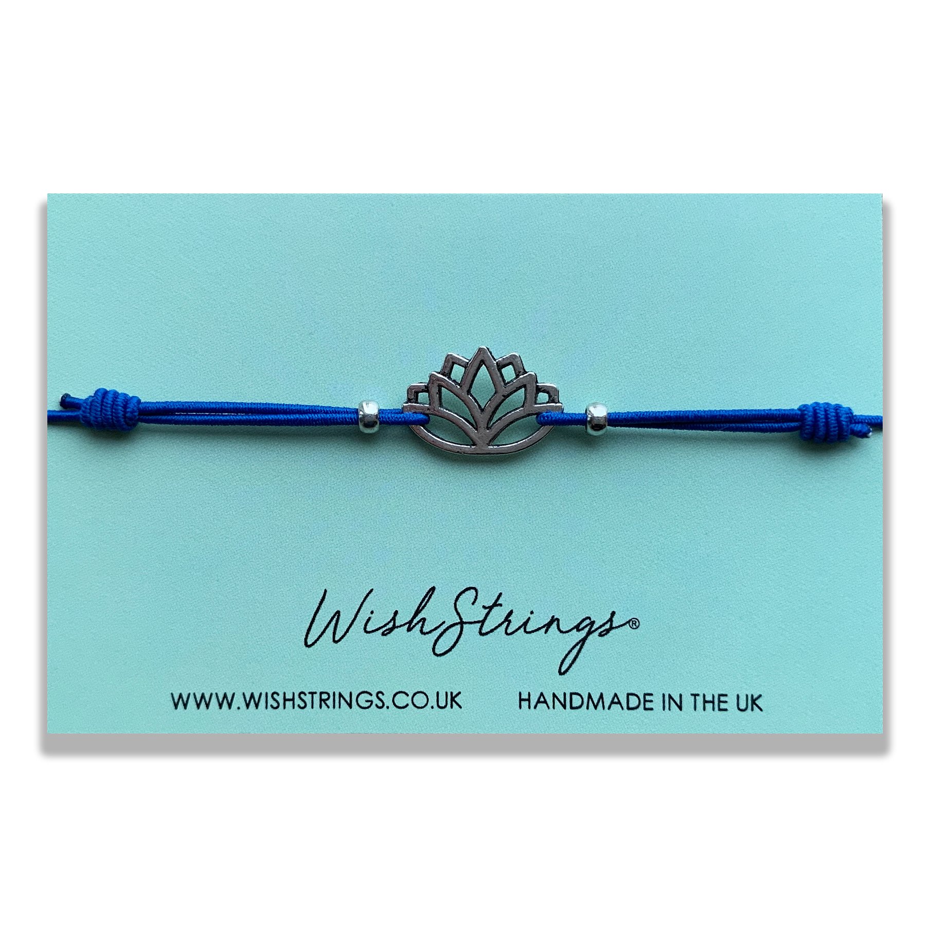 LOTUS Adjustable Cord Bracelet featuring a Tibetan charm, made from stretch elastic and cord, presented on a quality gloss card.