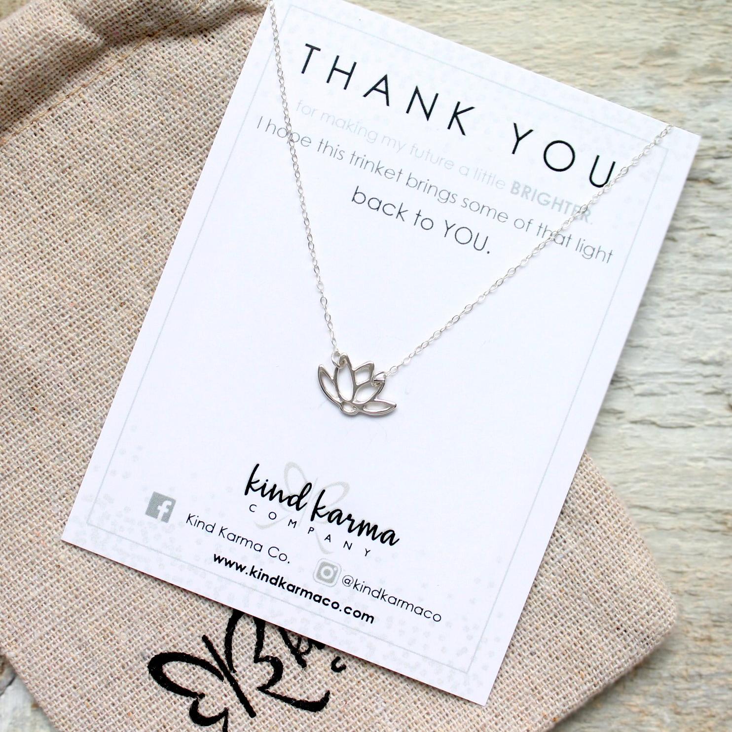 A delicate Lotus Necklace featuring a lotus flower pendant on a 14KT gold-filled or 925 sterling silver chain, symbolizing rebirth and resilience.