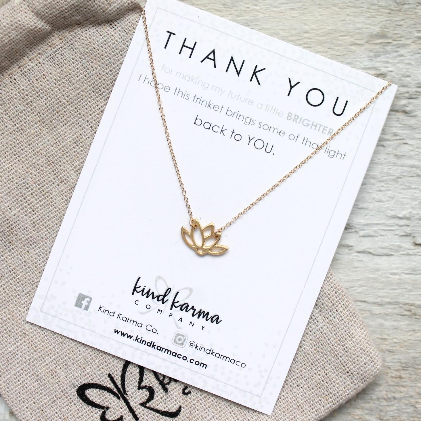 A delicate Lotus Necklace featuring a lotus flower pendant on a 14KT gold-filled or 925 sterling silver chain, symbolizing rebirth and resilience.