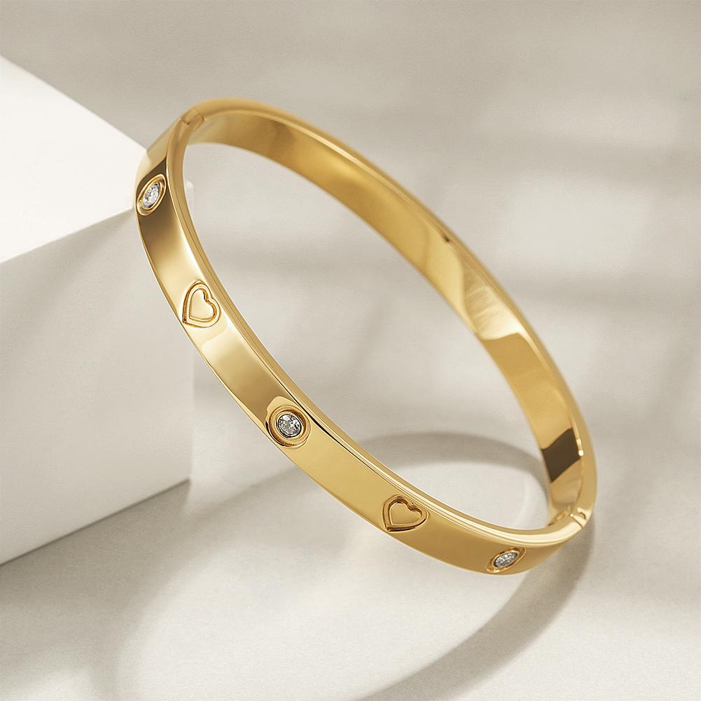 LOVE BANGLE BRACELET made of 316L surgical stainless steel with 14K gold PVD plating, showcasing its elegant design.