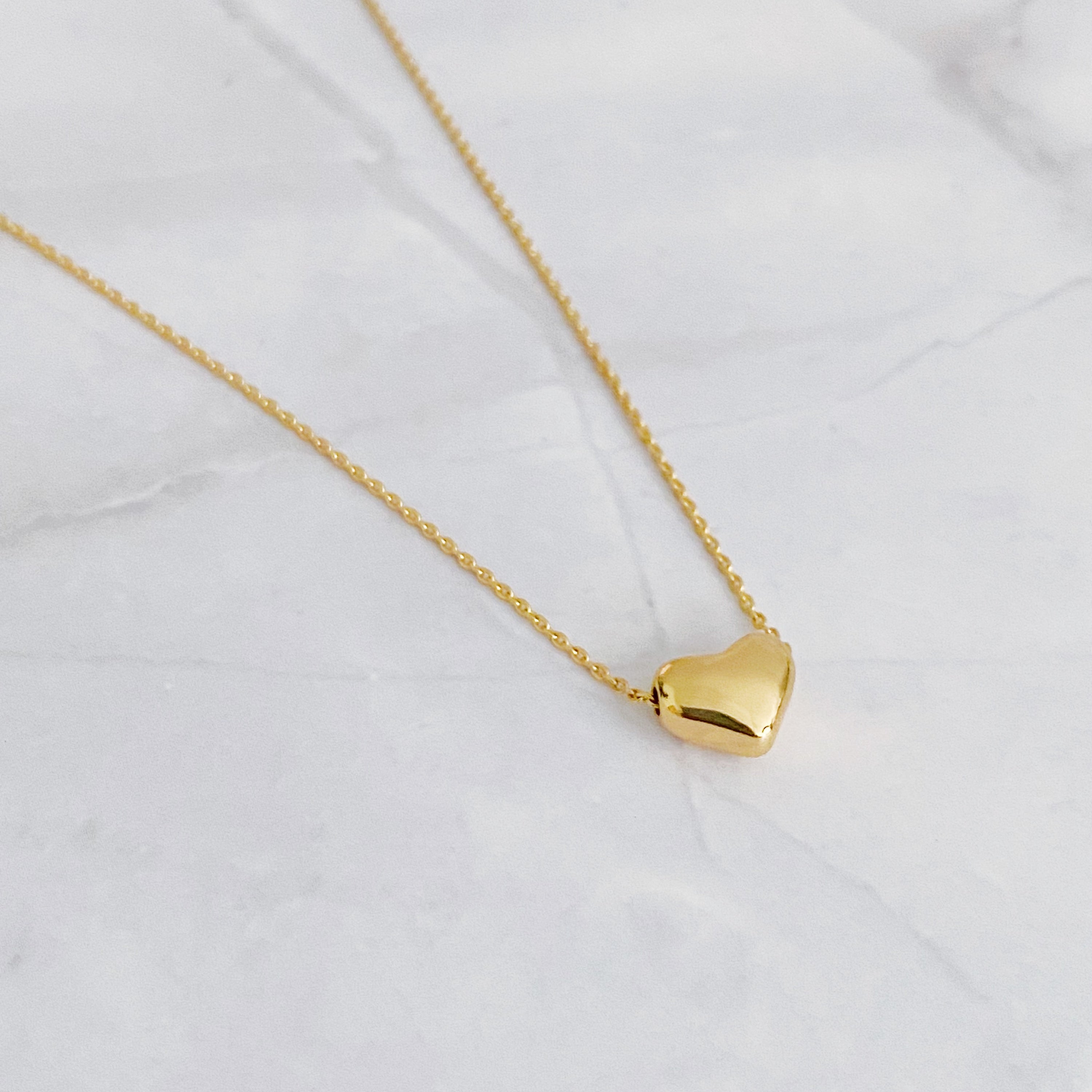 Love Bean Heart Necklace featuring a delicate chain and heart charm, perfect for everyday wear and gifting.