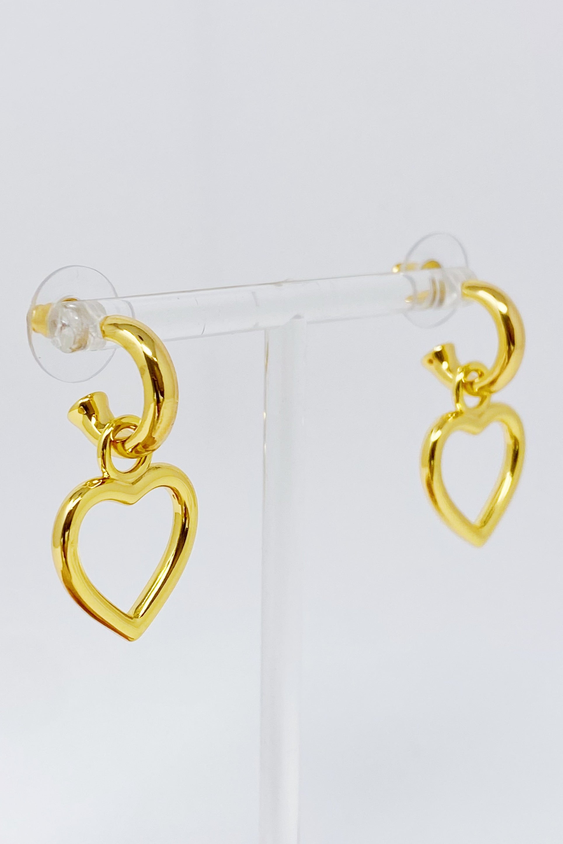 Love From Milan Heart Drop Earrings featuring a trendy dangling heart design in 18K gold plated brass.